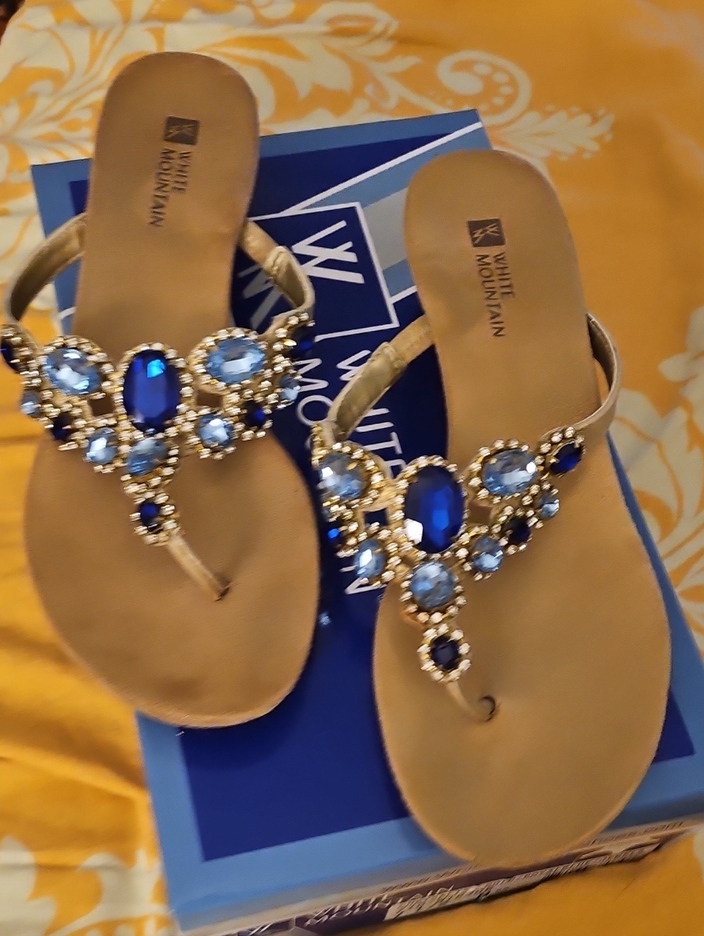 White Mountain Gold Sandals with Blue Gem Embellishments